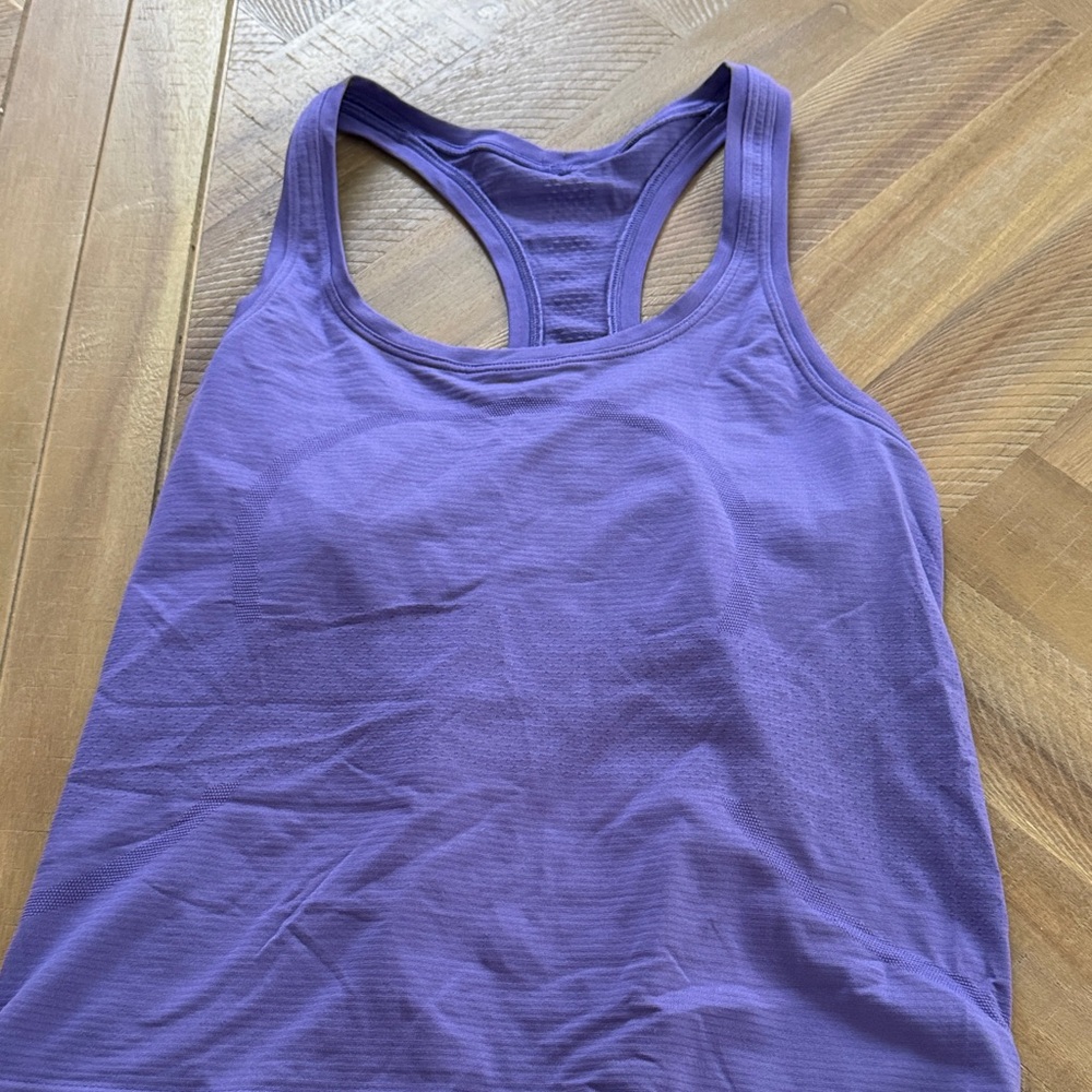 Lululemon purple swiftly tech racerback tank, waist length. Size 8